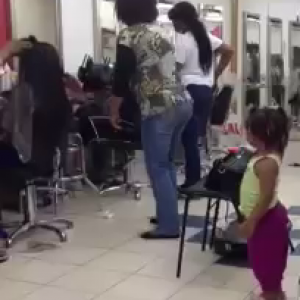 African Woman Dancing In A Hair Salon