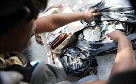 Cigarettes And Cash Seized In Upscale Jamaica Home.
